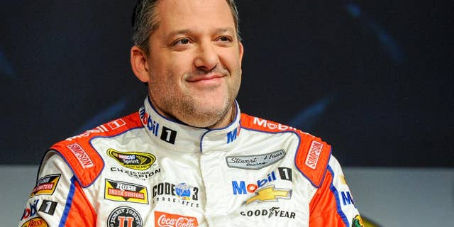 FILE - In this Thursay, Jan. 21, 2016, file photo, Stewart Haas Racing co-owner and driver Tony Stewart talks to members of the media during the NASCAR Charlotte Motor Speedway Media Tour in Charlotte, N.C. Stewart suffered his first serious hit since his return from a back injury during a three-car wreck at practice at Dover International Speedway, Friday, May 13, 2016. (AP Photo/Mike McCarn, File)