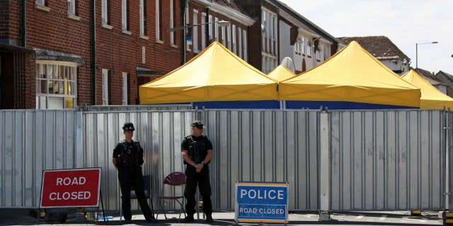Police officers on duty in Salisbury, England, as the investigation into the death of Dawn Sturgess, who died after being exposed to nerve agent novichok, continues, Tuesday July 10, 2018.