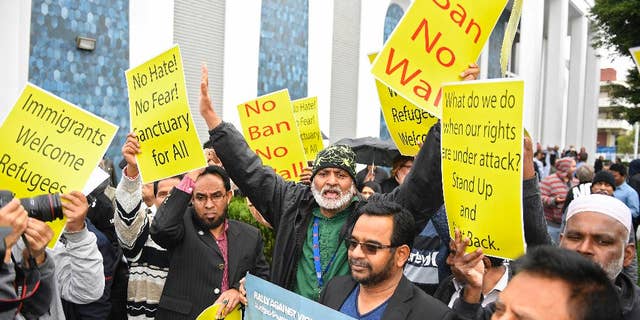 Supporters chant during a rally where civil rights, faith groups, labor, and community advocates and leaders gathered at the Islamic Center of Southern California as part of a nationwide day of unity, Friday, Feb. 3, 2017, in Los Angeles, to respond to President Trump's slew of executive orders targeting refugees and immigrants. The show of support and news conference was put on by the Coalition for Humane Immigrant Rights. (AP Photo/Mark J. Terrill)