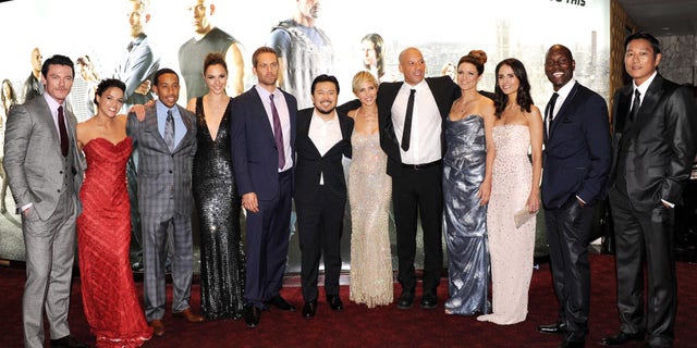 Actors Luke Evans, Michelle Rodriquez, Chris Ludacris Bridges, Gal Gadot, Paul Walker, director Justin Lin and actors Elsa Pataky, Vin Diesel, Gina Carano, Jordana Brewster, Tyrese Gibson and Ssung Kang attend the "Fast and Furious 6" world premiere on May 7, 2013 in London.