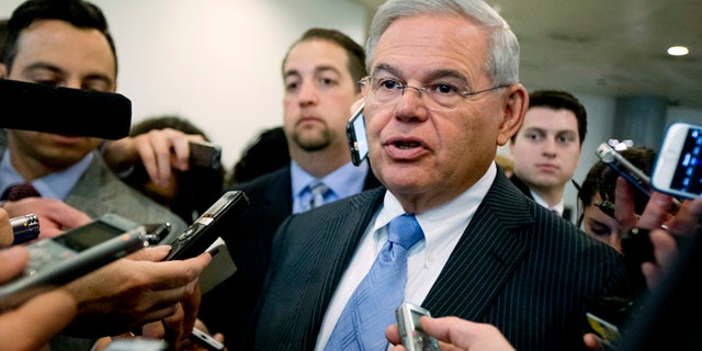 FILE - In this April 14, 2015, file photo, Sen. Robert Menendez, D-N.J. speaks with members of the media on Capitol Hill in Washington. Menendez, facing a federal indictment on bribery and corruption charges, reported his legal defense fund has raised nearly $1.3 million since it was launched last year and $430,000 from the start of this year until the day before he was indicted. Menendez, a Democrat, has denied any wrongdoing and vowed to fight the indictment, which alleges he helped his longtime friend and co-defendant, Florida eye doctor Salomon Melgen, with his business dealings in exchange for trips to a lavish villa in the Dominican Republic and campaign donations. (AP Photo/Manuel Balce Ceneta, File)