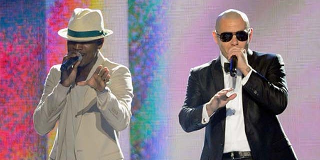 May 22, 2011: Singer Ne-Yo and rapper Pitbull perform onstage during the 2011 Billboard Music Awards at the MGM Grand Garden Arena in Las Vegas, Nev.