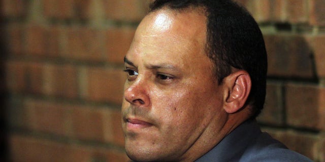Investigating officer Hilton Botha, sits inside the court witness box during the Oscar Pistorius bail hearing at the magistrate court in Pretoria, South Africa, Wednesday, Feb. 20, 2013. Olympic athlete Pistorius is charged with premeditated murder for the Feb. 14 shooting death of his girlfriend, Reeva Steenkamp. The bail hearing continues. (AP Photo/Themba Hadebe)