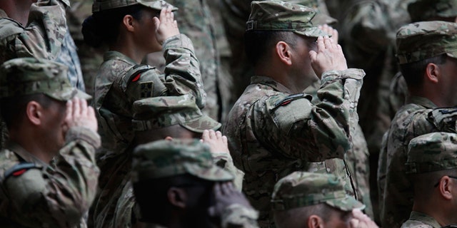 WIESBADEN, GERMANY - MAY 10: Soldiers of the U.S. Army V Corps conduct a color casing ceremony to mark the departure of V Corps headquarters from Europe on May 10, 2012 at the U.S. Army base in Wiesbaden, Germany. The U.S. Army V Corps, whose headquarters have been based in Germany nearly continuously since 1951, will leave Europe for good, with much of its command and operations structure scheduled to move to Afghanistan. The move is part of a broader restructuring of the U.S. military's overseas capabilities that also includes the likely redeployment of two U.S. infantry brigades out of Germany. (Photo by Ralph Orlowski/Getty Images)
