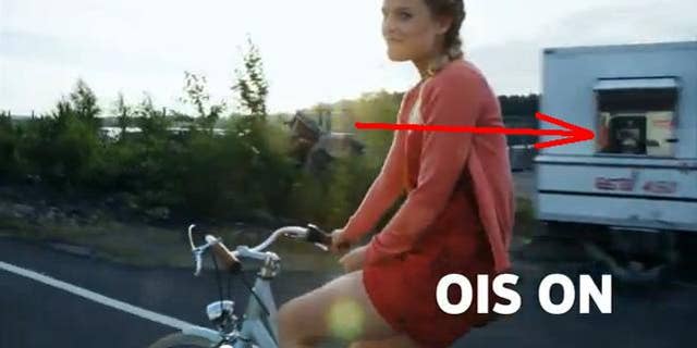 A still image from a promotional video for the Nokia 920, ostensibly shot by the phone itself, reveals the actual camera rig in a passing window.
