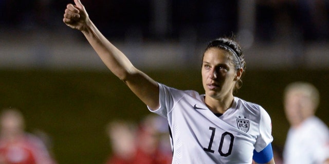United States' Carli Lloyd (10) looks toward fans after the United States defeatedChina 1-0 in a quarterfinal match in the FIFA Women's World Cup soccer tournament, Friday, June 26, 2015, in Ottawa, Ontario, Canada. (Adrian WyldThe Canadian Press via AP)