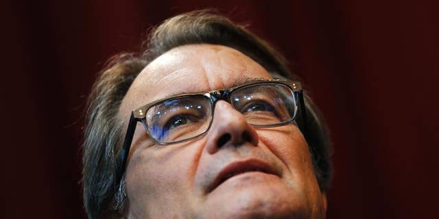 The President of Democratic Convergence of Catalonia Artur Mas listens to a question during a joint news conference with the president of the Esquerra Republicana de Catalunya, Oriol Junqueras, and the leader of the Catalan party "Junts pel si" Raul Romeva in Barcelona, Spain, Monday, Sept. 28, 2015. Secessionist parties that want Catalonia to break away from Spain were set Monday to embark on tough political negotiations aimed at giving them a majority in the regional parliament so they can push forward an independence plan. The threat of Catalonia breaking away from Spain has dominated the country's political scene for the past year but Spain's Prime Minister Mariano Rajoy rejects any possibility of Catalan independence as unconstitutional. (AP Photo/Francisco Seco)