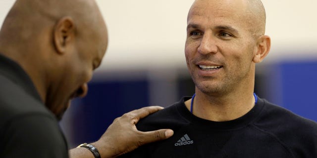 Brooklyn Nets general manager Billy King, left, talks with head coach Jason Kidd during NBA basketball training camp at Duke University in Durham, N.C., Tuesday, Oct. 1, 2013. (AP Photo/Gerry Broome)