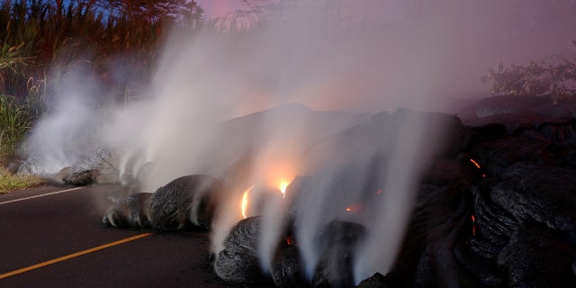 Volcanic gases rise from the Kilauea lava flow that crossed Pohoiki Road near Highway 132, near Pahoa, Hawaii, U.S., May 28, 2018.