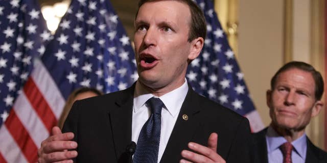 FILE - In this June 16, 2016 file photo, Sen. Chris Murphy, D-Conn., left, accompanied by Sen. Richard Blumenthal, D-Conn., speaks on Capitol Hill in Washington. Democrats get their long-sought votes on gun control a week after the massacre in Orlando, Florida, but the prospects for any election-year changes in the nation’s laws are dim. The four votes on Monday, June 20, 2016, are the result of a deal after Murphy filibustered for almost 15 hours in response to the Orlando shooting. (AP Photo/J. Scott Applewhite, File)