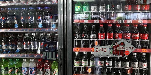 US soft drinks giants Coca-Cola and PepsiCo must make their sugar suppliers act to stop so-called land grabs in countries such as Brazil and Cambodia, Oxfam said on Wednesday
