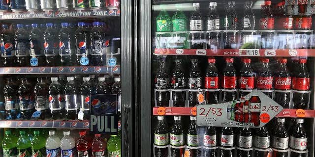 US soft drinks giants Coca-Cola and PepsiCo must make their sugar suppliers act to stop so-called land grabs in countries such as Brazil and Cambodia, Oxfam said on Wednesday