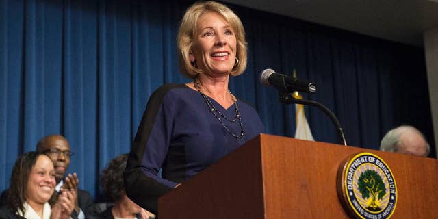 Education Secretary Betsy DeVos addresses Education Department staff, Wednesday, Feb. 8, 2017, at the Education Department in Washington. (AP Photo/Molly Riley)