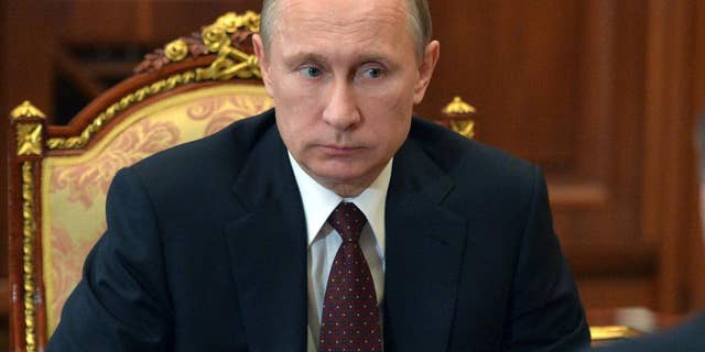 Russian President Vladimir Putin listens during a meeting at the Kremlin, in Moscow, Russia, Tuesday, March 10, 2015.(AP Photo/RIA Novosti, Alexei Druzhinin, Presidential Press Service)