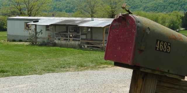 A home in Cumberland County, Ky, is seen on May 1, 2013, where a 2-year-old girl was shot by her 5-year-old brother with a gun designed for children. Investigators say the Tuesday shooting was accidental. The children's mother was home at the time of the shooting Tuesday afternoon but had stepped out to the front porch for a few minutes and "she heard the gun go off," Cumberland County Coroner Gary White said. He said the rifle was kept in a corner and the family didn't realize a bullet was left inside it.(AP Photo/Dylan Lovan)