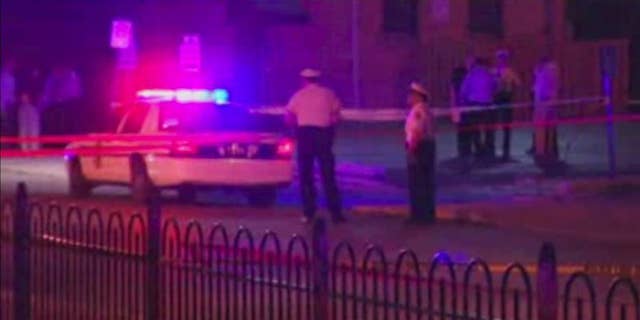 In this frame from video, police work at the scene of a shooting on Wednesday, Sept. 14, 2016, in Columbus, Ohio. Police in Ohio responding to a report of an armed robbery shot and killed a boy who they said pulled a gun from his waistband that was later determined to be a BB gun. (WSYX via AP)