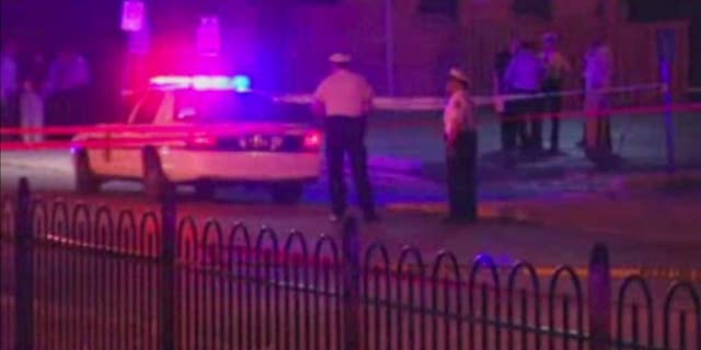 In this frame from video, police work at the scene of a shooting on Wednesday, Sept. 14, 2016, in Columbus, Ohio. Police in Ohio responding to a report of an armed robbery shot and killed a boy who they said pulled a gun from his waistband that was later determined to be a BB gun. (WSYX via AP)