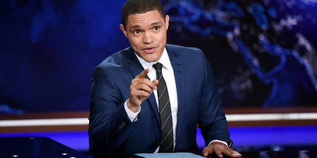 FILE - In this Sept. 29, 2015, file photo, Trevor Noah works on set during a taping of