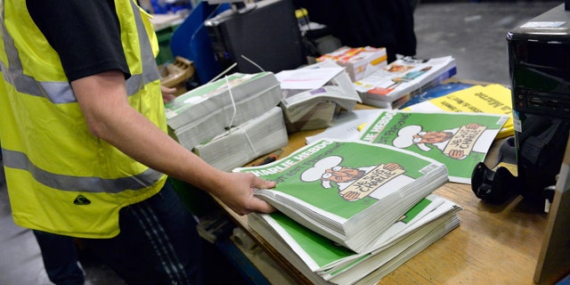 MARNE-LA-VALLEE, FRANCE - JANUARY 14: A worker prepares the new edition of Charlie Hebdo for delivery in a press distribution center in the suburbs on January 14, 2014 in Marne-la-Vallee, France. Three million copies of the controversial magazine have been printed in the wake of last week's terrorist attacks. A second delivery of the magazine is scheduled for tomorrow. (Photo by Aurelien Meunier/Getty Images)