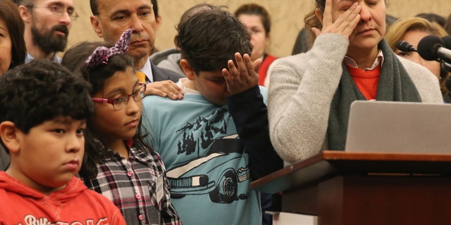 WASHINGTON, DC - JANUARY 14: Isabel Aguilar (R) speaks about immigration while flanked by her children Adolfo Martinez 13 (C), Miranda Aguilar 8 (2ndL), and Emillio Aguilar 7 (L), during a news conference on Capitol Hill, January 14, 2015 in Washington, DC. Ms. Aguilar joined House Democrats to urge members of Congress not to pass legislation to fund the Department of Homeland Security with attached anti-immigrant amendments. (Photo by Mark Wilson/Getty Images)