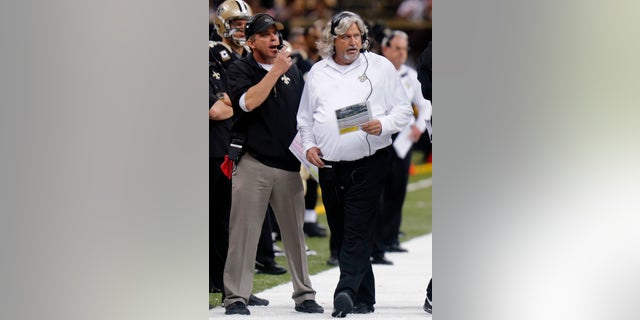 New Orleans Saints head coach Sean Payton, left, and and defensive coordinator Rob Ryan work the sidelines during the second half of an NFL football game against the Buffalo Bills in New Orleans, Sunday, Oct. 27, 2013. (AP Photo/Bill Haber)