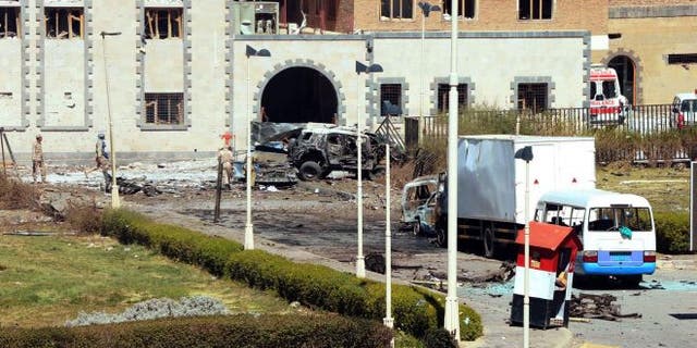 December 5, 2013: In this photo provided by Yemen's Defense Ministry, security forces are on the scene after an explosion at the Defense Ministry complex in Sanaa, Yemen. A suicide car bomber struck Yemen's Defense Ministry Thursday, killing more than a dozen soldiers and paving the way for a carload of gunmen wearing army uniforms to storm the heavily guarded compound in the capital of Sanaa, military and hospital officials said. (AP Photo/Yemen Defense Ministry) (The Associated Press)