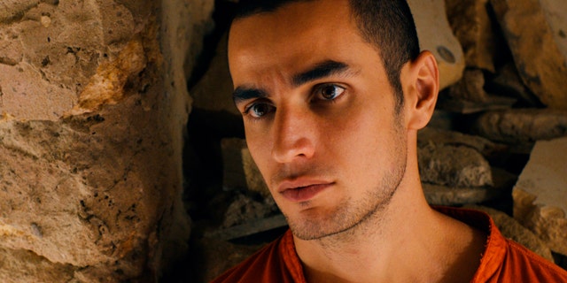 FILE - This file photo released by Adopt Films shows Adam Bakri in a scene from the film "Omar." The drama, set amid the Israeli-Palestinian conflict, was nominated for an Academy Award for best foreign picture on Thursday, Jan. 16, 2014. After hearing the news of his latest nomination, director Hany Abu-Assad said Thursday that having the academy refer to his entry as being from Palestine was a step in the right direction. (AP Photo/Adopt Films, File)