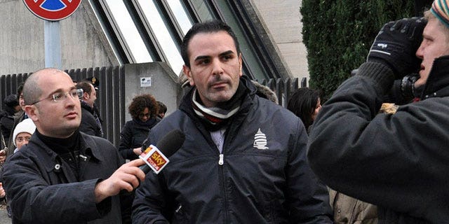 Jan. 27, 2012: Costa Concordia cruise ship first officer Ciro Ambrosio, center, leaves the prosecutor's office after being heard in regard to the cruise ship's grounding off the Tuscan island of Giglio in Grosseto, Italy.