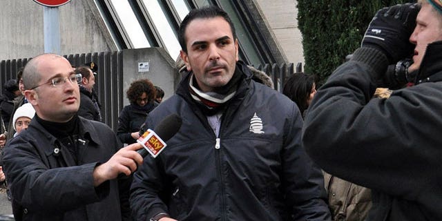Jan. 27, 2012: Costa Concordia cruise ship first officer Ciro Ambrosio, center, leaves the prosecutor's office after being heard in regard to the cruise ship's grounding off the Tuscan island of Giglio in Grosseto, Italy.
