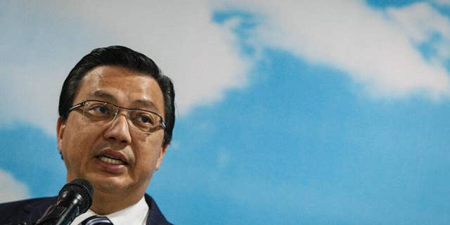 Malaysian Transport Minister Liow Tiong Lai speaks at an event in Shah Alam, Malaysia Wednesday, Aug. 12, 2015. Malaysian officials said Wednesday they are considering to bring back the debris if confirmed to be from Malaysia Airlines Flight 370. Last week, Malaysia said a wing fragment found on the Indian Ocean island of Reunion was confirmed to be from the plane that went missing March 8, 2014, with 239 people aboard while flying from Kuala Lumpur to Beijing. (AP Photo/Joshua Paul)