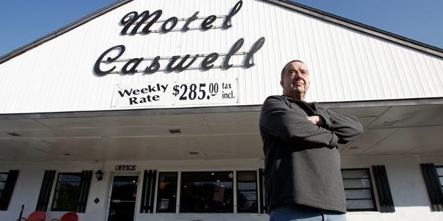 Russell Caswell stands outside the Tewksbury, Mass., motel that local, state and federal authorities tried to seize. (AP File)