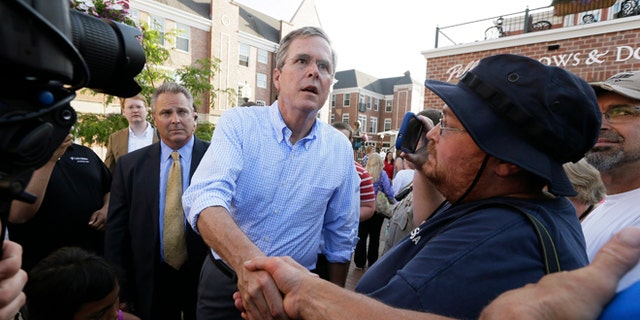 Republican presidential candidate Jeb Bush greets supporters following a town hall meeting, Wednesday, June 17, 2015, in Pella, Iowa. (AP Photo/Charlie Neibergall)