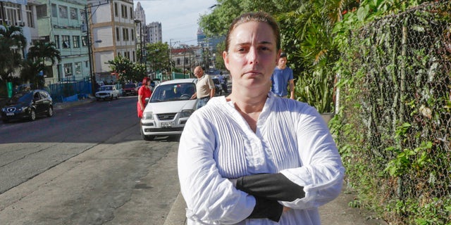 Cuban performance artist Tania Bruguera poses for a picture in a street of Havana, on December 31, 2014, upon her released from a police station.