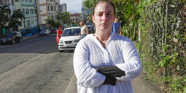 Cuban performance artist Tania Bruguera poses for a picture in a street of Havana, on December 31, 2014, upon her released from a police station.