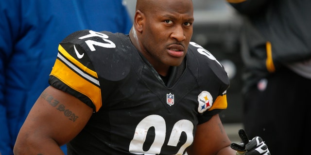 FILE - In this Dec. 30, 2012 file photo, Pittsburgh Steelers outside linebacker James Harrison (92) sits on the sidelines during the fourth quarter of an NFL football game against the Cleveland Browns in Pittsburgh. The Cincinnati Bengals have officially signed free agent James Harrison, the five-time Pro Bowl linebacker from the rival Steelers. The Bengals didn't release terms in Tuesday's, April 23, 2013 announcement. (AP Photo/Gene J. Puskar, File)