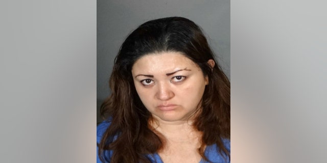 This undated law enforcement booking photo provided by the Los Angeles Police Department shows Veronica Aguilar, 39. Aguilar has been charged with murder in the death of her severely malnourished 11-year-old son Yonatan, whose body was found wrapped in a blanket in a closet in their Los Angeles home Monday, Aug. 22, 2016. Aguilar was charged Thursday, Aug. 25, with one count each of murder and child abuse in the death of her son. (Los Angeles Police Department via AP)