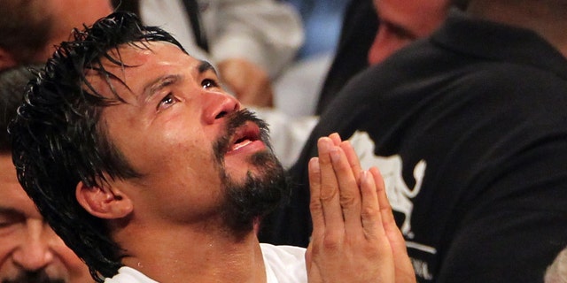 LAS VEGAS, NV - JUNE 09: Manny Pacquiao reacts after his fight against Timothy Bradley at MGM Grand Garden Arena on June 9, 2012 in Las Vegas, Nevada. (Photo by Jeff Bottari/Getty Images)