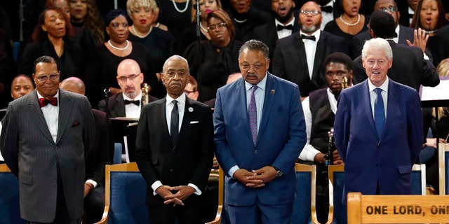 Louis Farrakhan, from left, Rev. Al Sharpton, Rev. Jesse Jackson and former President Bill Clinton attend the funeral service for Aretha Franklin at Greater Grace Temple, Friday, Aug. 31, 2018, in Detroit. Franklin died Aug. 16, 2018 of pancreatic cancer at the age of 76. (AP Photo/Paul Sancya)