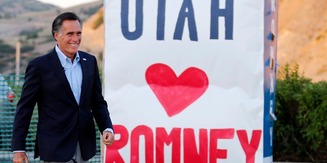 Mitt Romney flashes his trademark smile after his Republican Senate nomination in Utah.