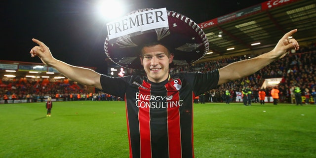 BOURNEMOUTH, ENGLAND - APRIL 27: Ryan Fraser of Bournemouth celebrates victory on the pitch after the Sky Bet Championship match between AFC Bournemouth and Bolton Wanderers at Goldsands Stadium on April 27, 2015 in Bournemouth, England. Bournemouth's 3-0 victory puts them on the brink of promotion to the Barclays Premier League. (Photo by Clive Rose/Getty Images)