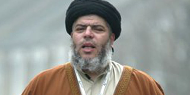March 28, 2003: In this file photo, radical Muslim cleric Abu Hamza al-Masri prays in a street outside his Mosque in north London Europe's human rights court ruled on Tuesday, April 10, 2012 that it would be legal for Britain to extradite an Egyptian-born radical Muslim cleric and five other terror suspects to the United States.