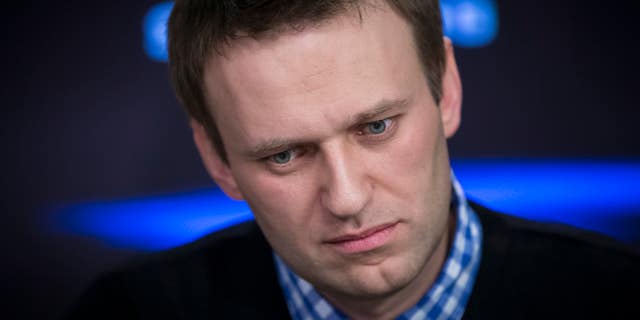 Russian opposition leader Alexey Navalny listens to a question during an interview at the Echo Moskvy (Echo of Moscow) radio station in Moscow, Russia, Monday, April 8, 2013. Navalny made his name as an anti-corruption whistleblower and spearheaded massive anti-Kremlin protests that followed the rigged parliament election in Dec. 2011. (AP Photo/Alexander Zemlianichenko)