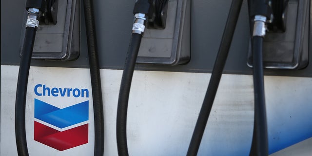 SAN FRANCISCO, CA - MAY 02:  The Chevron logo is displayed on a gas pump at a Chevron gas station on May 2, 2014 in San Francisco, California.  Chevron Corp. reported a 27 percent plunge in first quarter profits with earnings of $4.51 billion, or $2.36 a share, compare to $6.18 billion, or $3.18 a share, one year ago.  (Photo by Justin Sullivan/Getty Images)