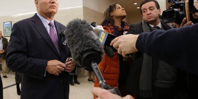 Stephen C, Worth, left, attorney for New York City police officer Peter Liang, speaks to reporters after Liang's arraignment at Brooklyn Superior court, Wednesday, Feb. 11, 2015, in New York. Liang, who fired into a darkened stairwell last November at a Brooklyn public housing complex, accidentally killing 28-year-old Akai Gurley, has been charged with manslaughter, official misconduct and other charges. He was released without bail. (AP Photo/Mary Altaffer)