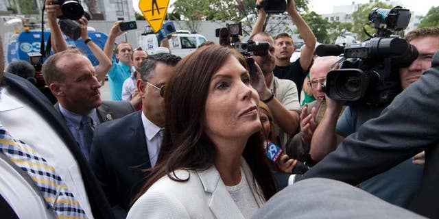 Pennsylvania Attorney General Kathleen Kane arrives to be processed and arraigned on charges she leaked secret grand jury material and then lied about it under oath, Saturday, Aug. 8, 2015, at the Montgomery County detective bureau in Norristown, Pa. Kane, the state’s first elected female attorney general, vows to fight the charges, which include perjury, obstruction and conspiracy. (AP Photo/Matt Rourke)
