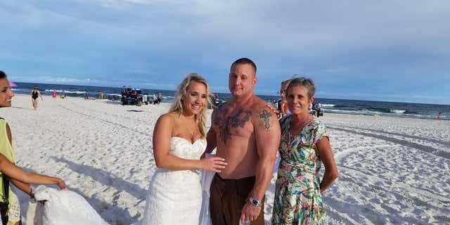 Moments after he got married, Coast Guard Petty Officer 2nd Class Zac Edwards saved a man from drowning on an Alabama beach.