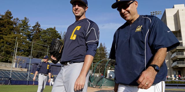 In this Feb. 19, 2014 photo, California baseball coach David Esquer, right, walks off the field with pitcher Kyle Porter after a team practice in Berkeley, Calif. While in the midst of taking classes at California and simultaneously pondering his collegiate baseball future after his sport got cut, pitcher Kyle Porter considered leaving Berkeley for Oregon in early 2011 to play for the Ducks immediately that season. (AP Photo/Ben Margot)