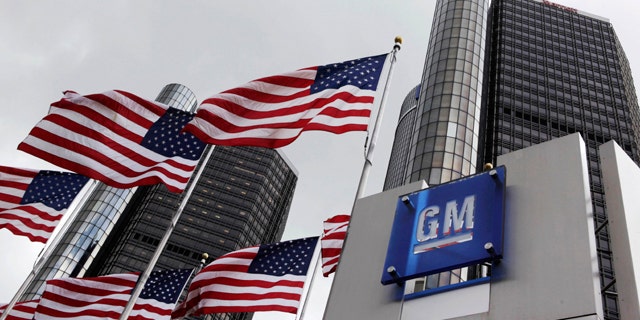 FILE: American flags fly outside General Motors world headquarters in Detroit.