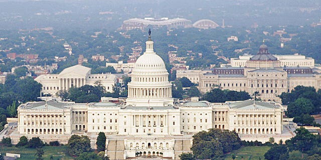 The United States Capitol, center, the Capitol Reflecting Pool, foreground, the U.S. Supreme Court.