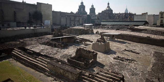 File photo - Tourists visit the Templo Mayor archaeological site in Mexico City, Tuesday Dec. 1, 2015.